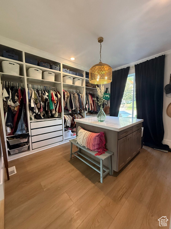 Walk in closet featuring light wood-style floors