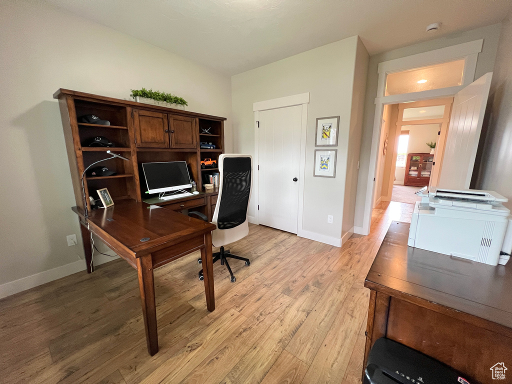 Office featuring light wood-type flooring and baseboards