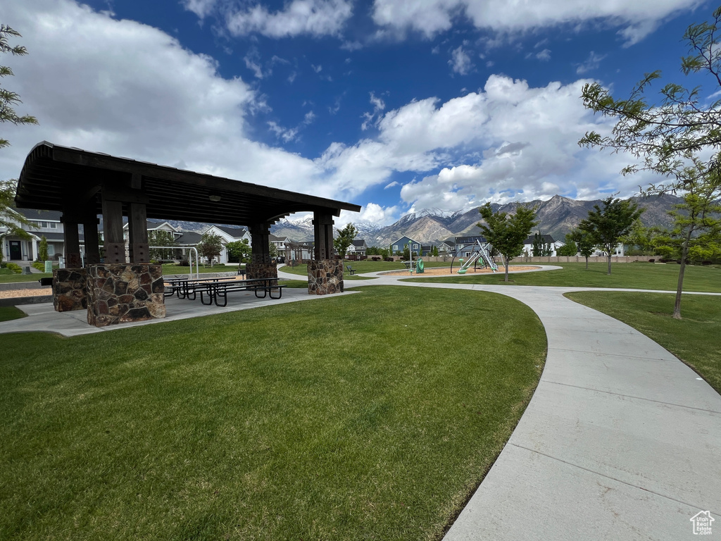 View of property\\\'s community with a gazebo, a lawn, and a mountain view