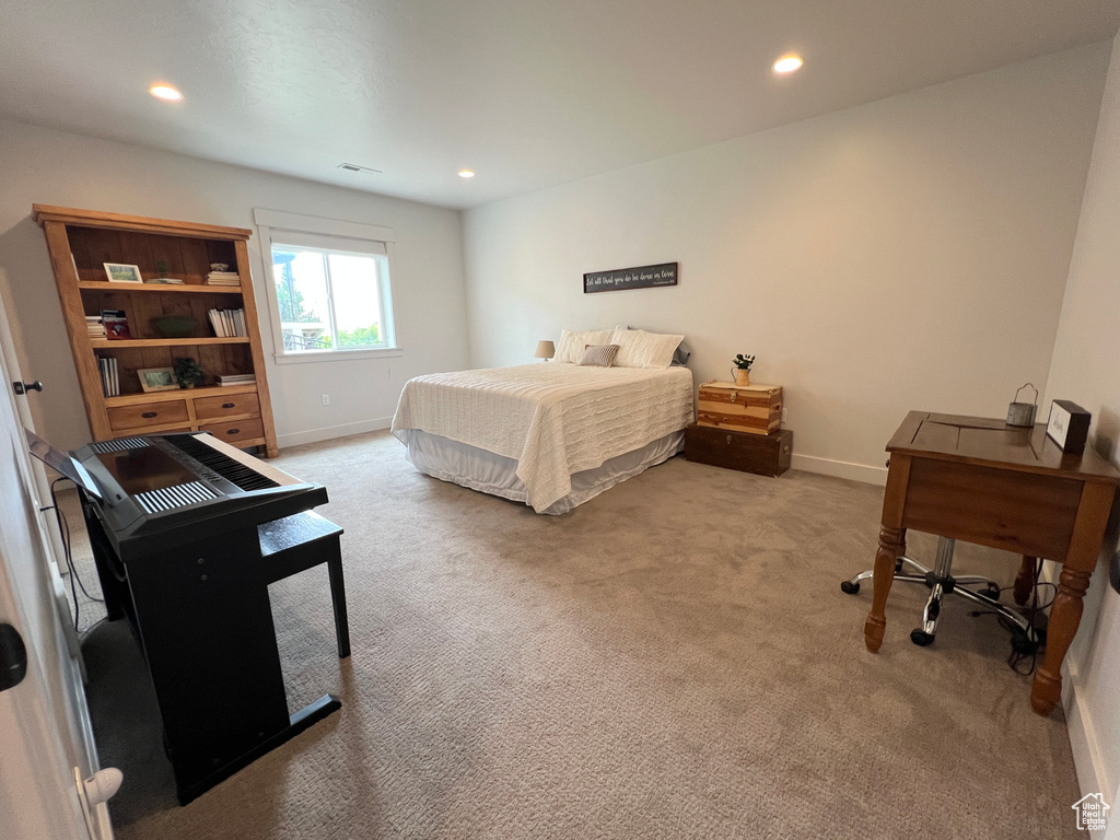 Carpeted bedroom featuring baseboards and recessed lighting