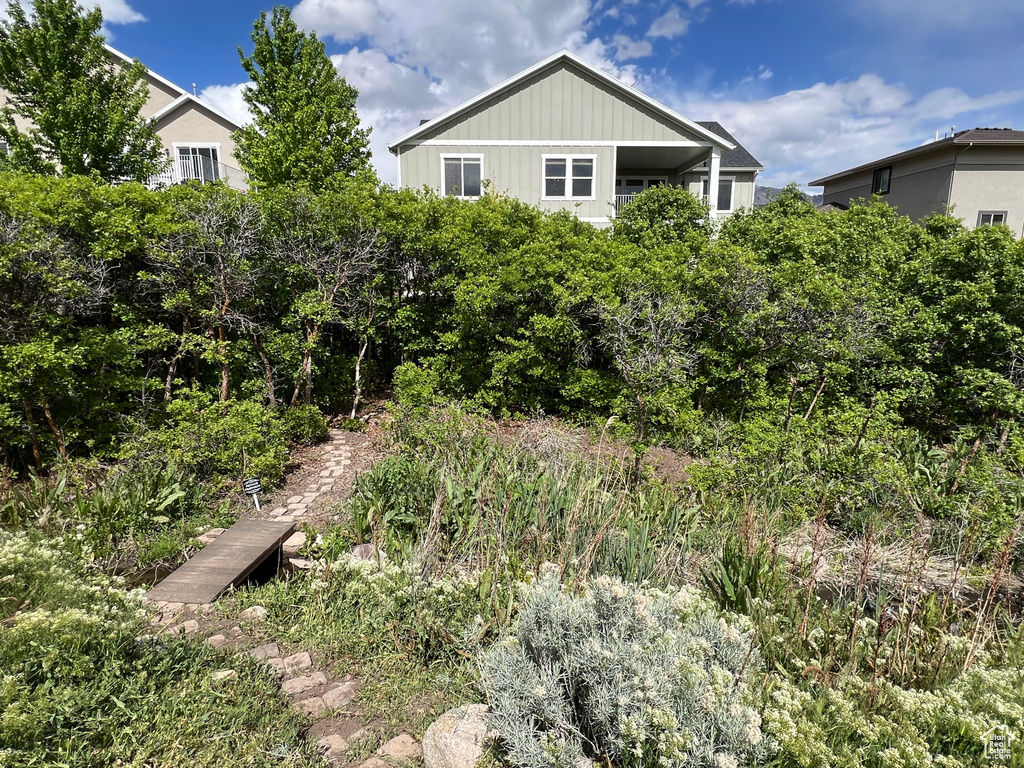 Rear view of property featuring board and batten siding