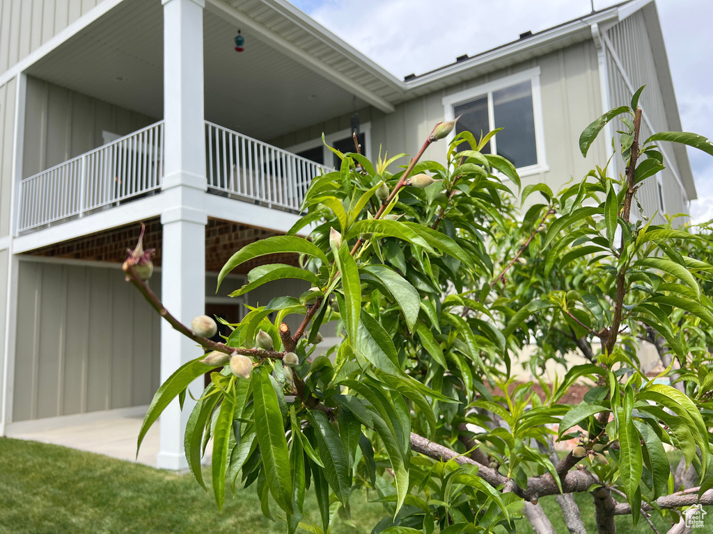 View of property exterior with board and batten siding
