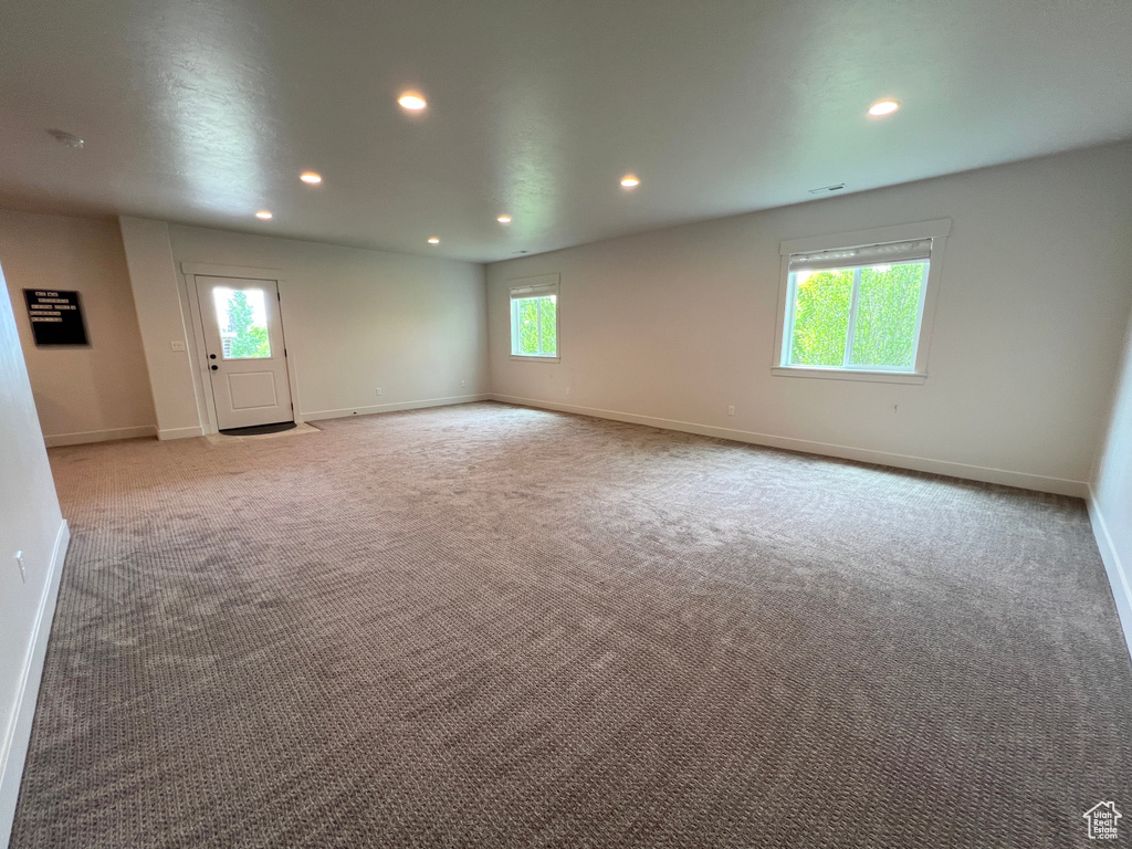 Empty room with recessed lighting, baseboards, and carpet flooring