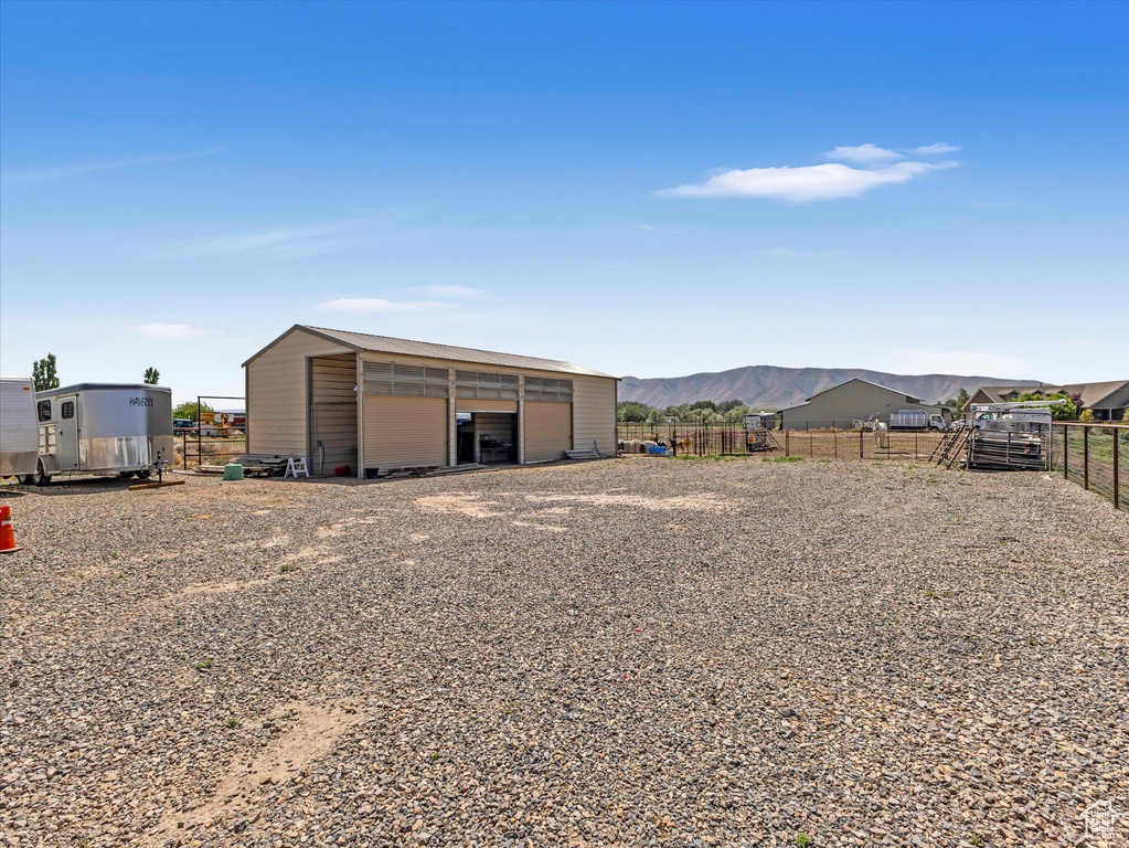 View of outbuilding with a mountain view