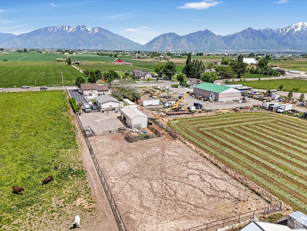 View of rural area featuring mountains and large plots for crops
