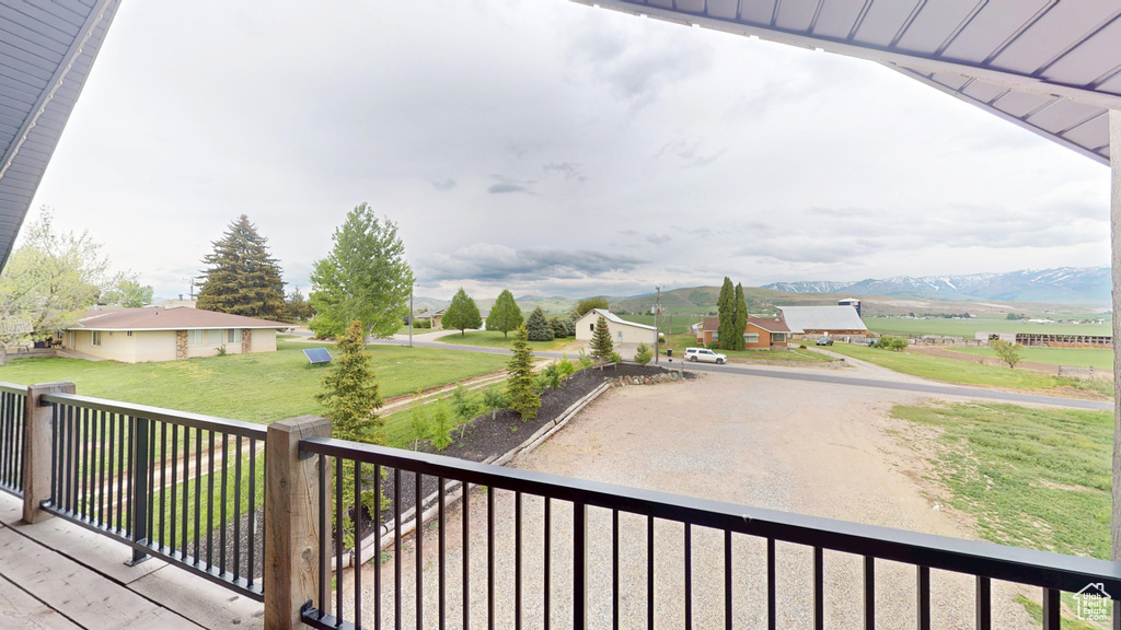 Wooden terrace featuring a mountain view