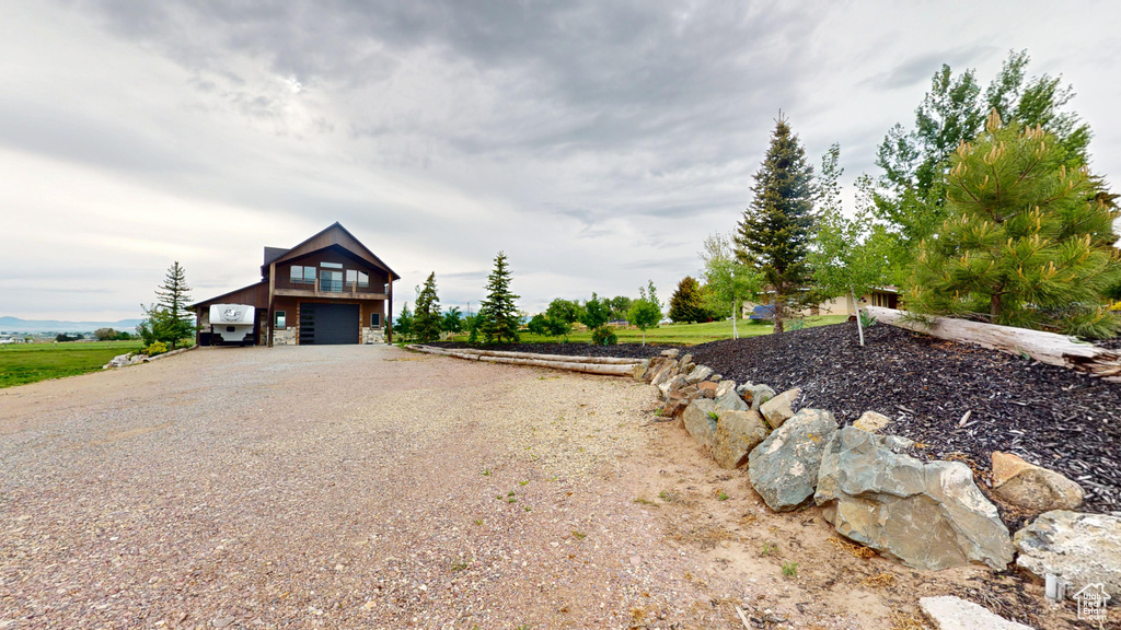 View of front of house with driveway and a garage