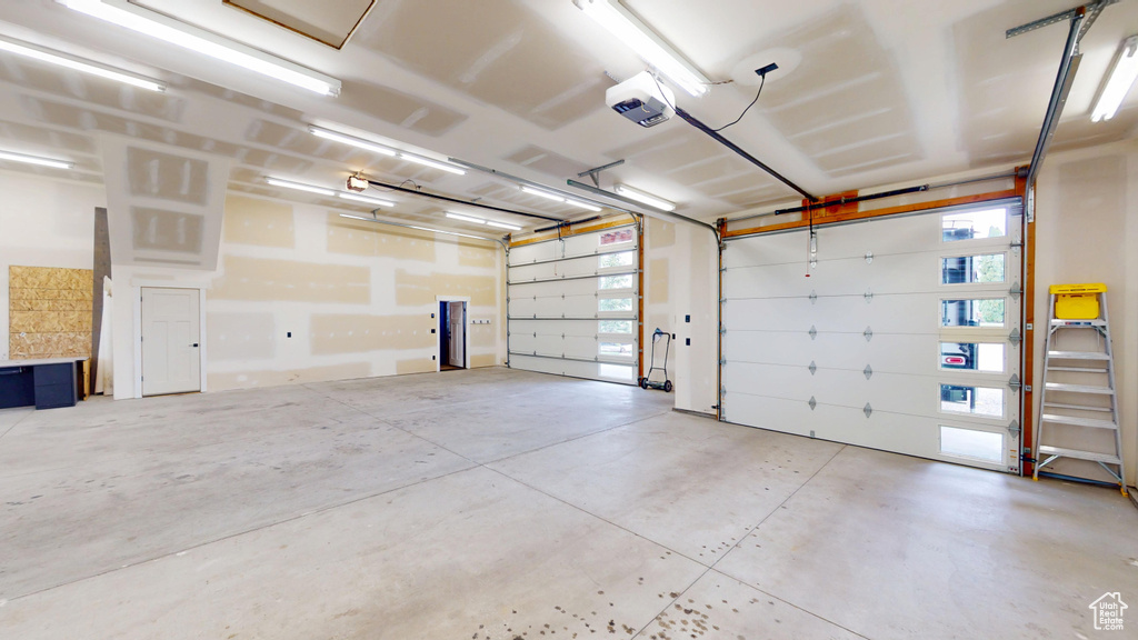 Garage featuring a garage door opener
