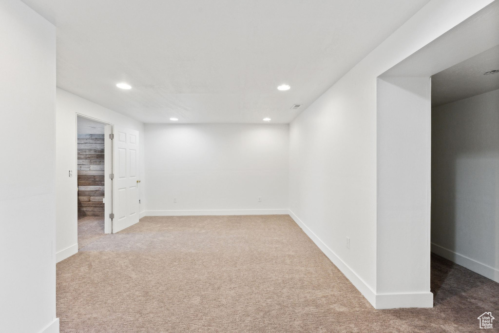 Below grade area featuring carpet floors, recessed lighting, and baseboards