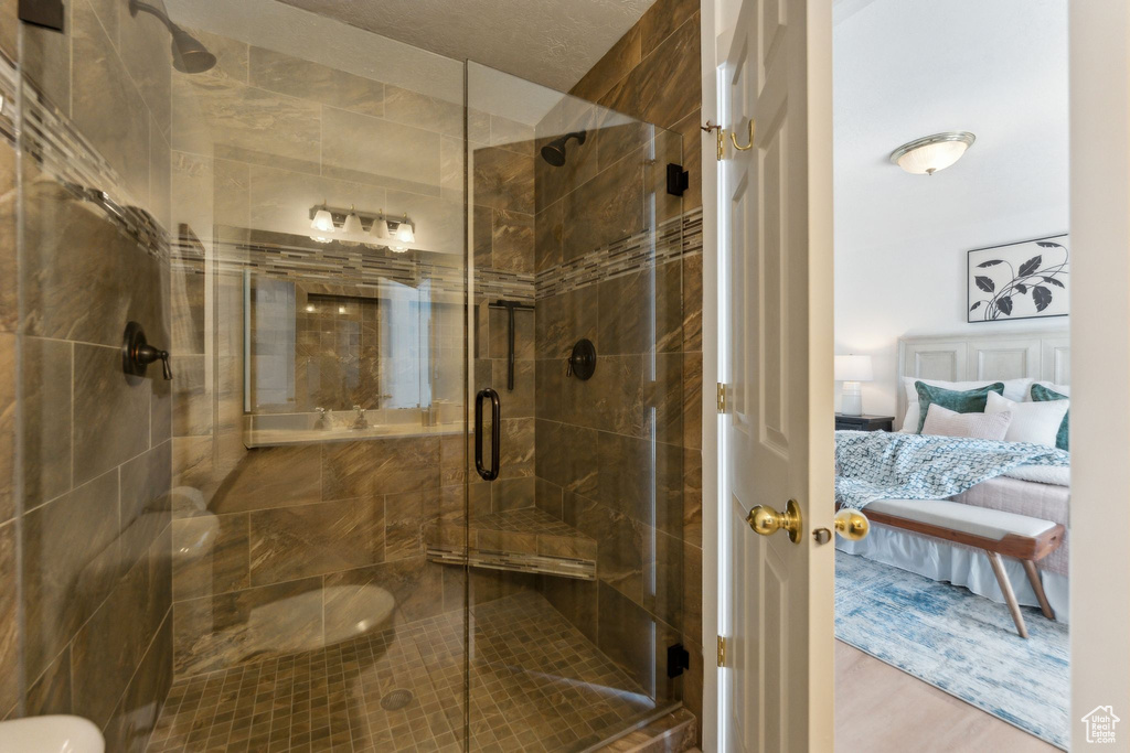 Ensuite bathroom with a stall shower