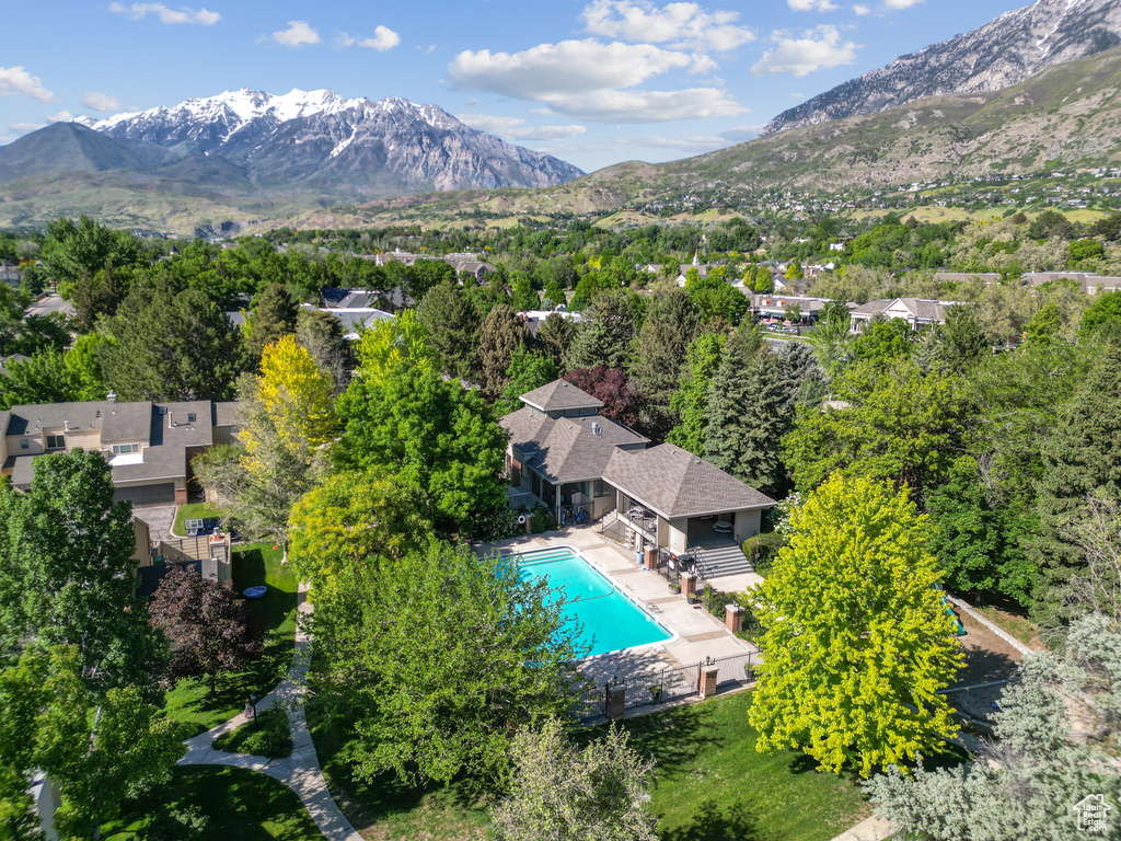 Bird\'s eye view of a mountain backdrop and a pool