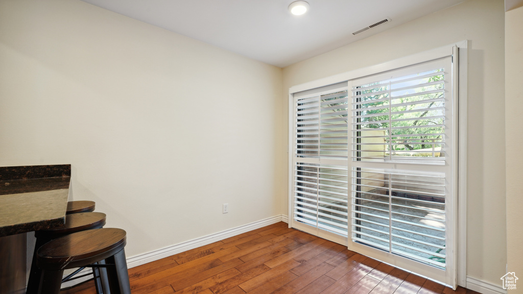 Sitting room with hardwood / wood-style flooring and baseboards
