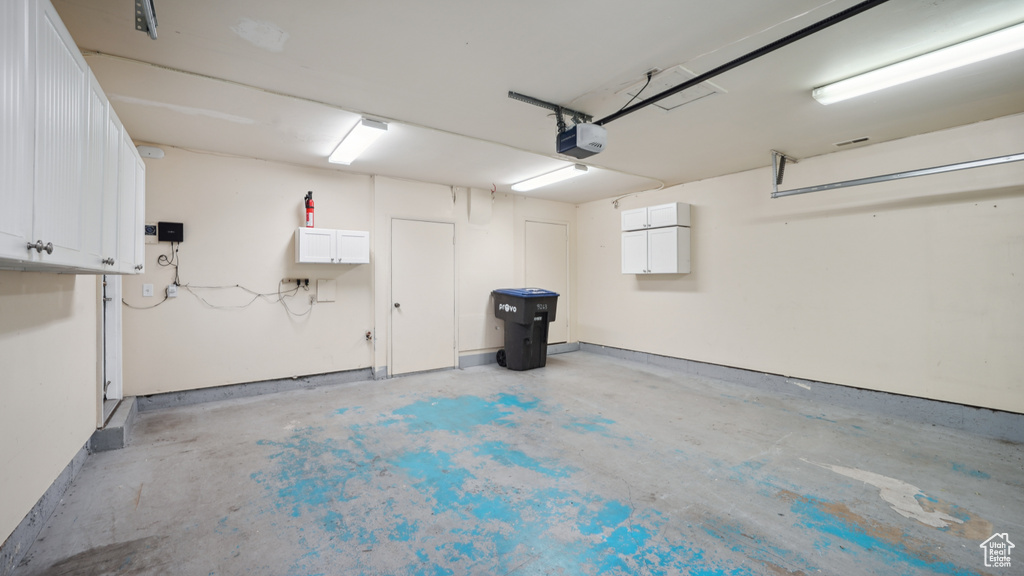 Garage featuring a garage door opener