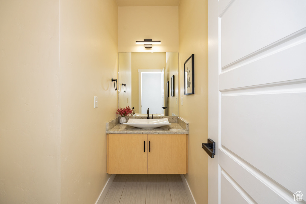 Bathroom with vanity and baseboards