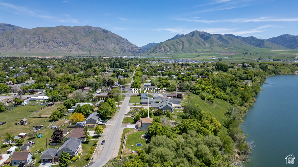 Aerial view of residential area featuring a water and mountain view
