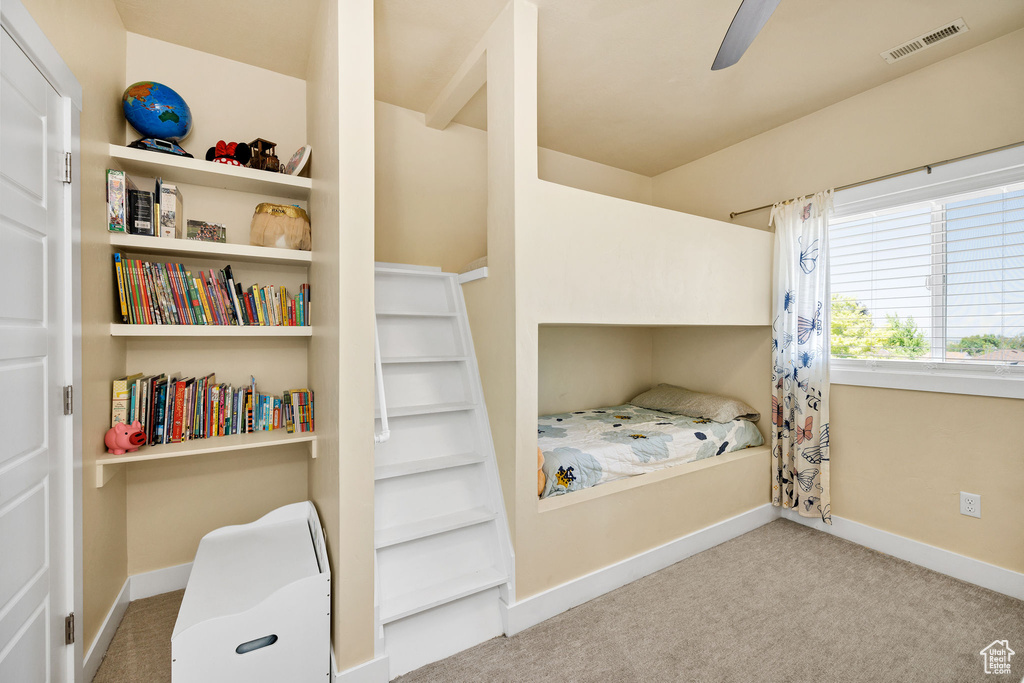 Bedroom featuring carpet flooring, baseboards, and ceiling fan