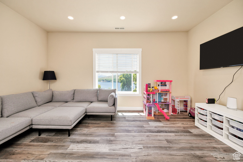 Living area with recessed lighting and wood finished floors