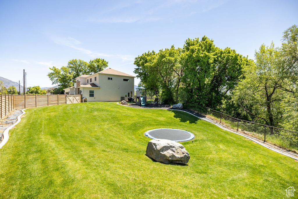 View of yard featuring a playground