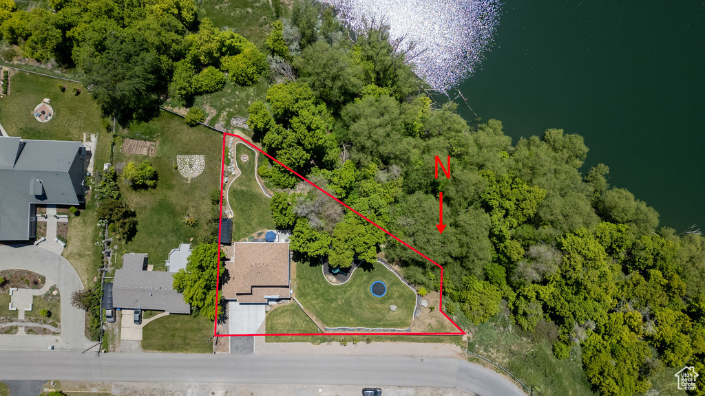 Aerial view of property and surrounding area with property parcel outlined