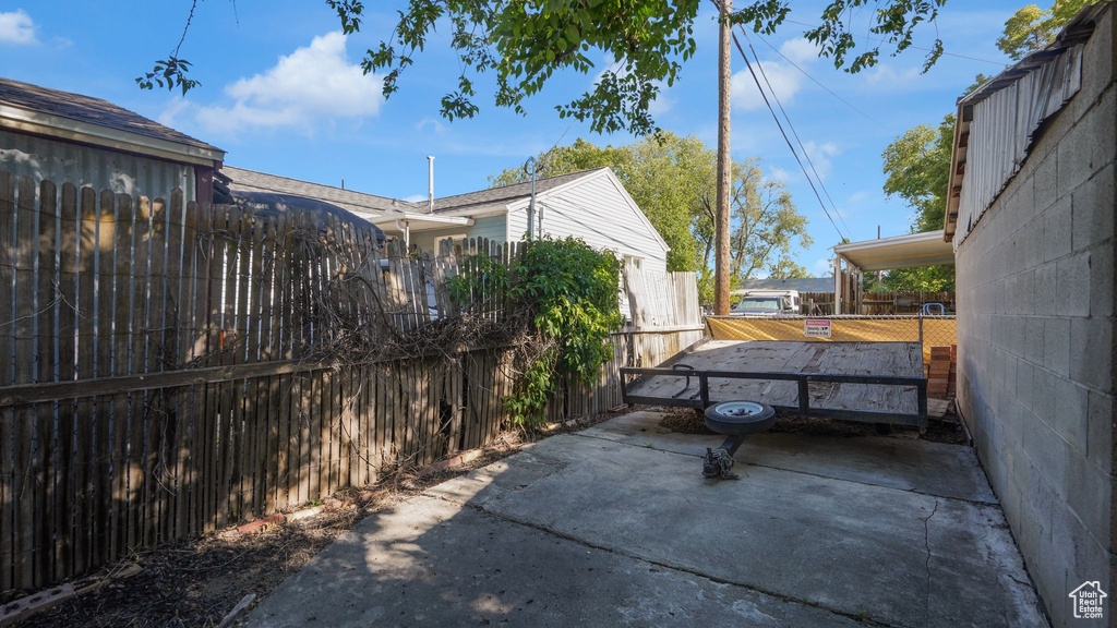 Fenced backyard with a patio area
