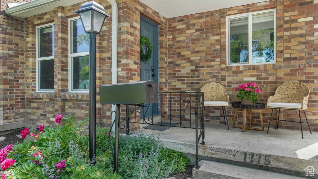 Entrance to property with brick siding