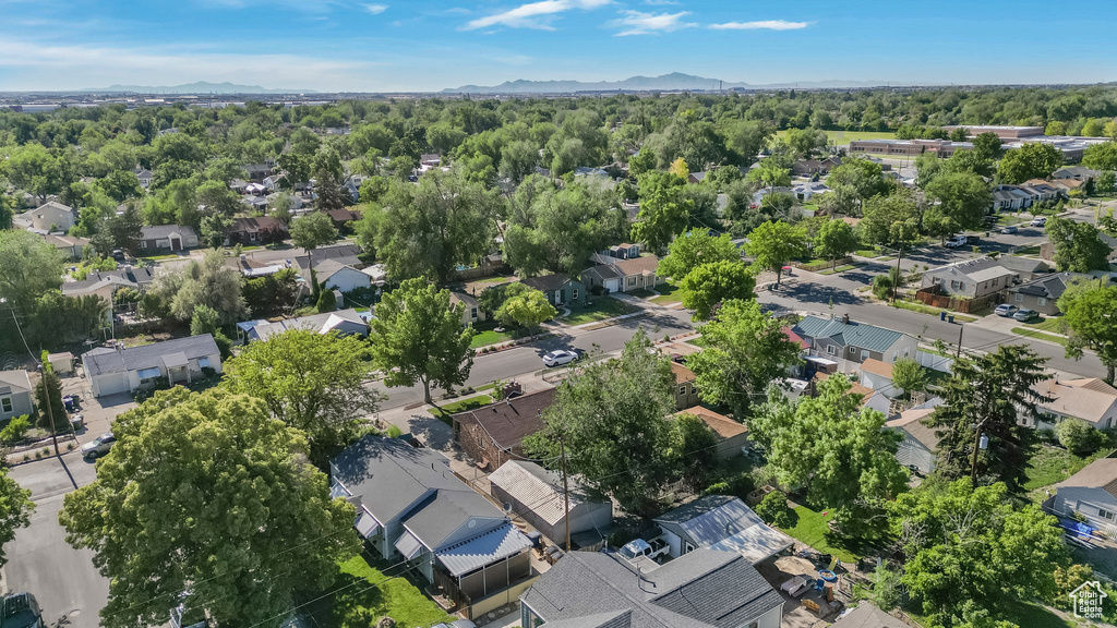 Aerial overview of property\\\'s location with nearby suburban area and a mountain backdrop