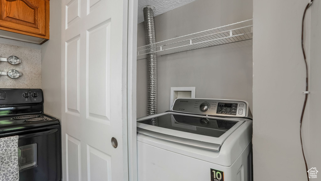 Washroom featuring washer / clothes dryer