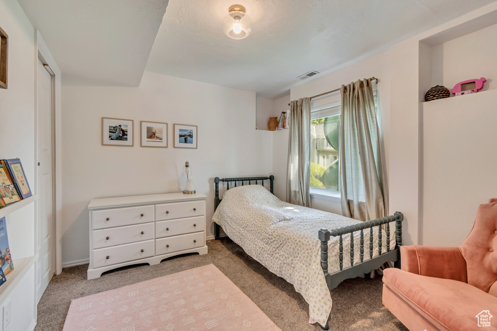 Bedroom with carpet