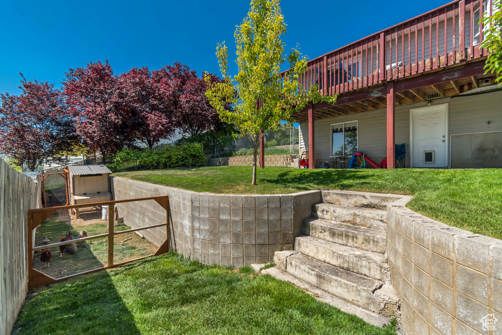 View of yard with a wooden deck