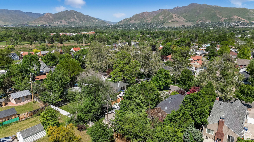 Aerial view of residential area featuring mountains