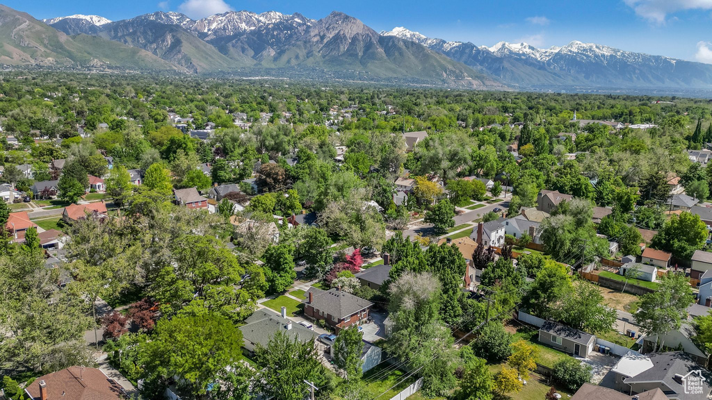 Aerial perspective of suburban area with a mountain backdrop