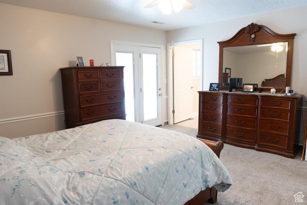 Bedroom with carpet flooring and a ceiling fan