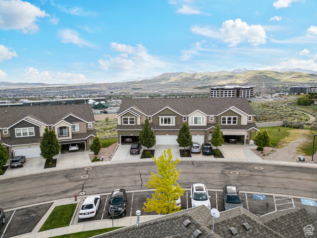 Aerial perspective of suburban area with a mountain backdrop