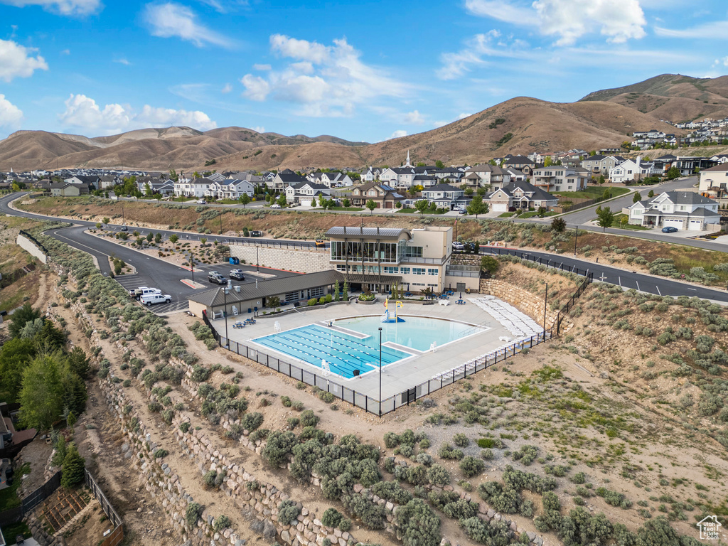 View of swimming pool featuring a residential view and a mountain view