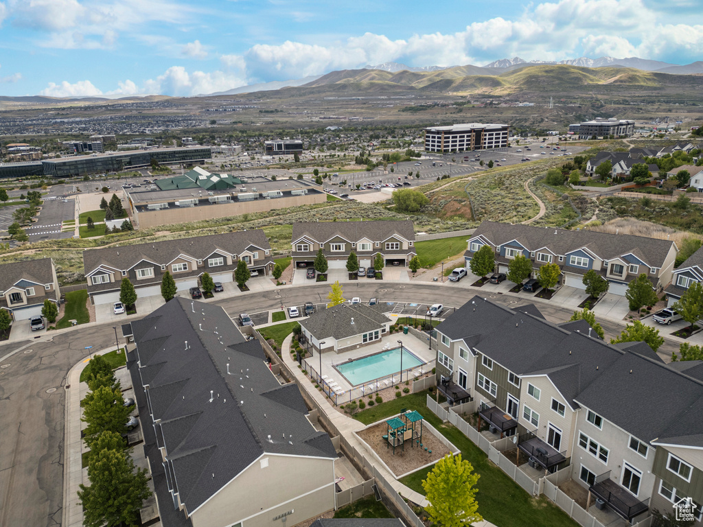 Bird\'s eye view of a mountain backdrop and a pool