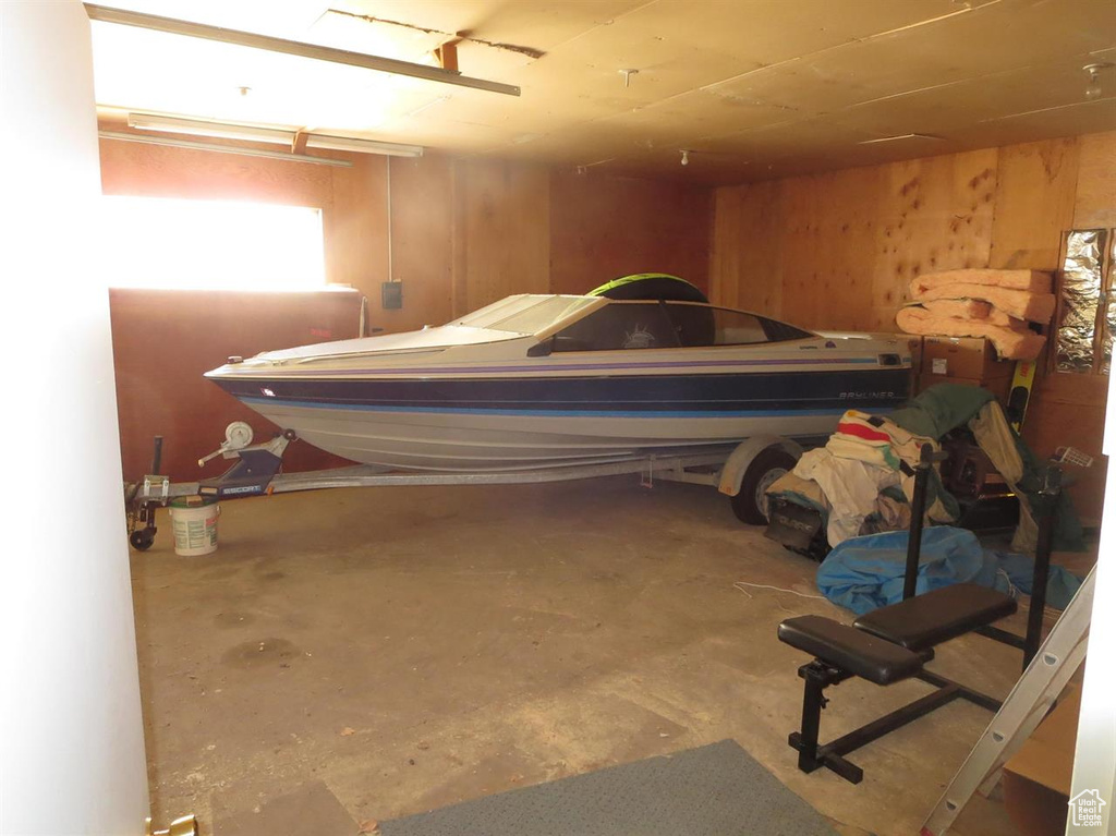 Garage featuring wood walls