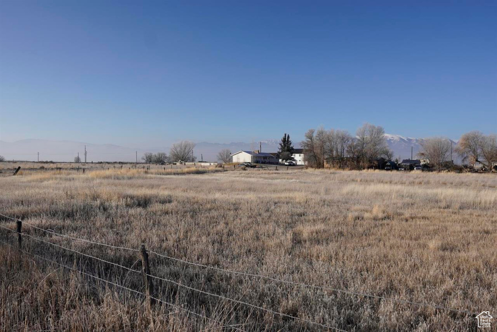 View of yard with a rural view