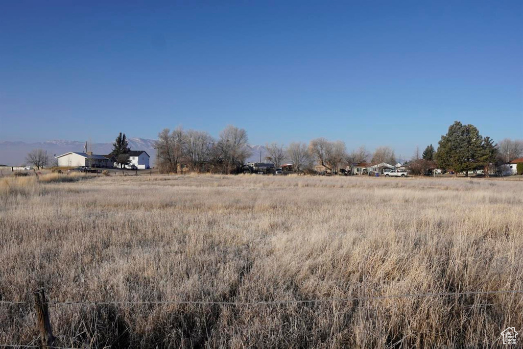 View of yard with a rural view