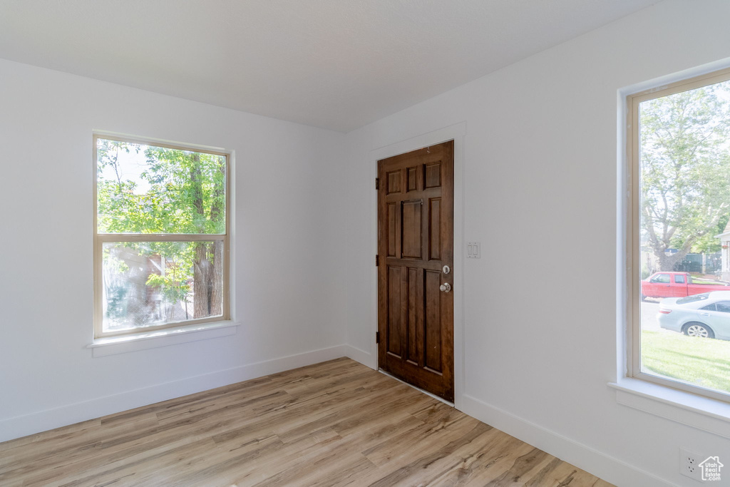 Entrance foyer featuring light wood finished floors and baseboards