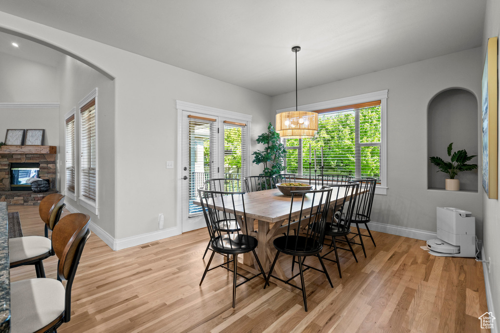 Dining space featuring light wood-style floors and baseboards