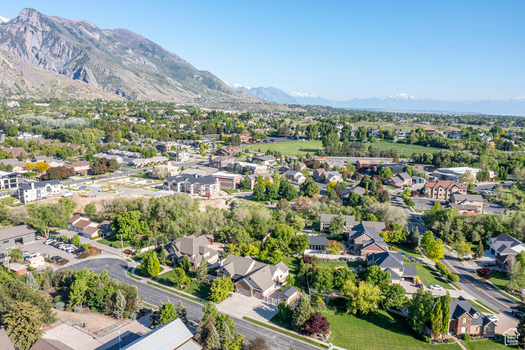 Aerial perspective of suburban area with a mountainous background