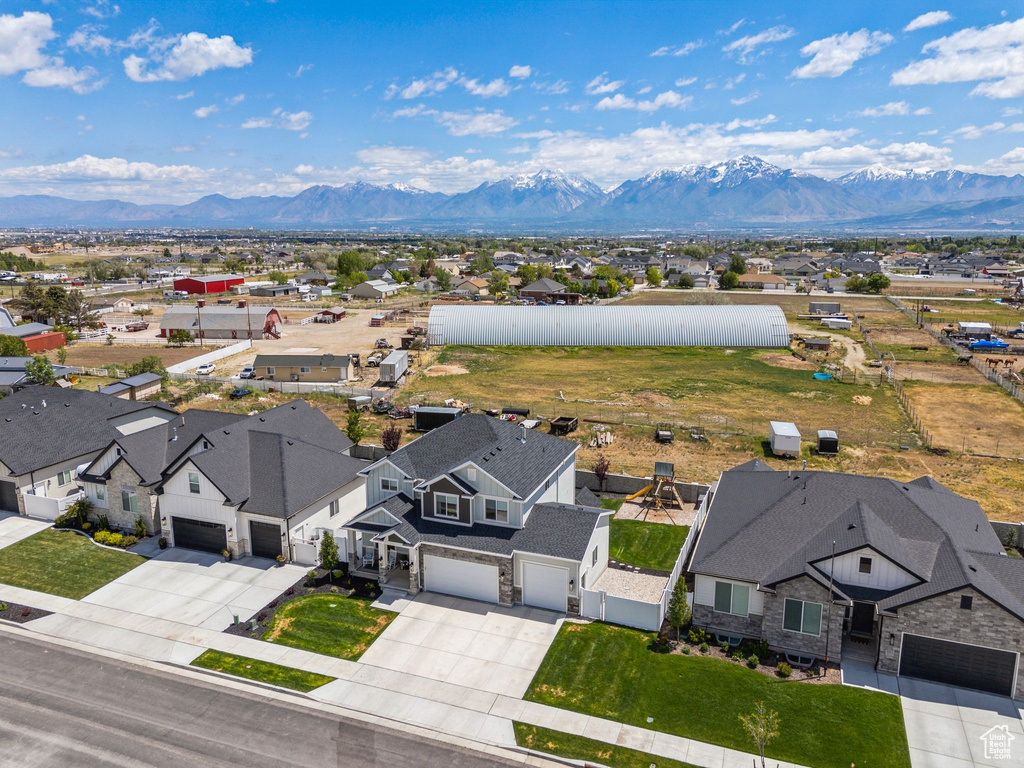 Aerial perspective of suburban area featuring a mountainous background