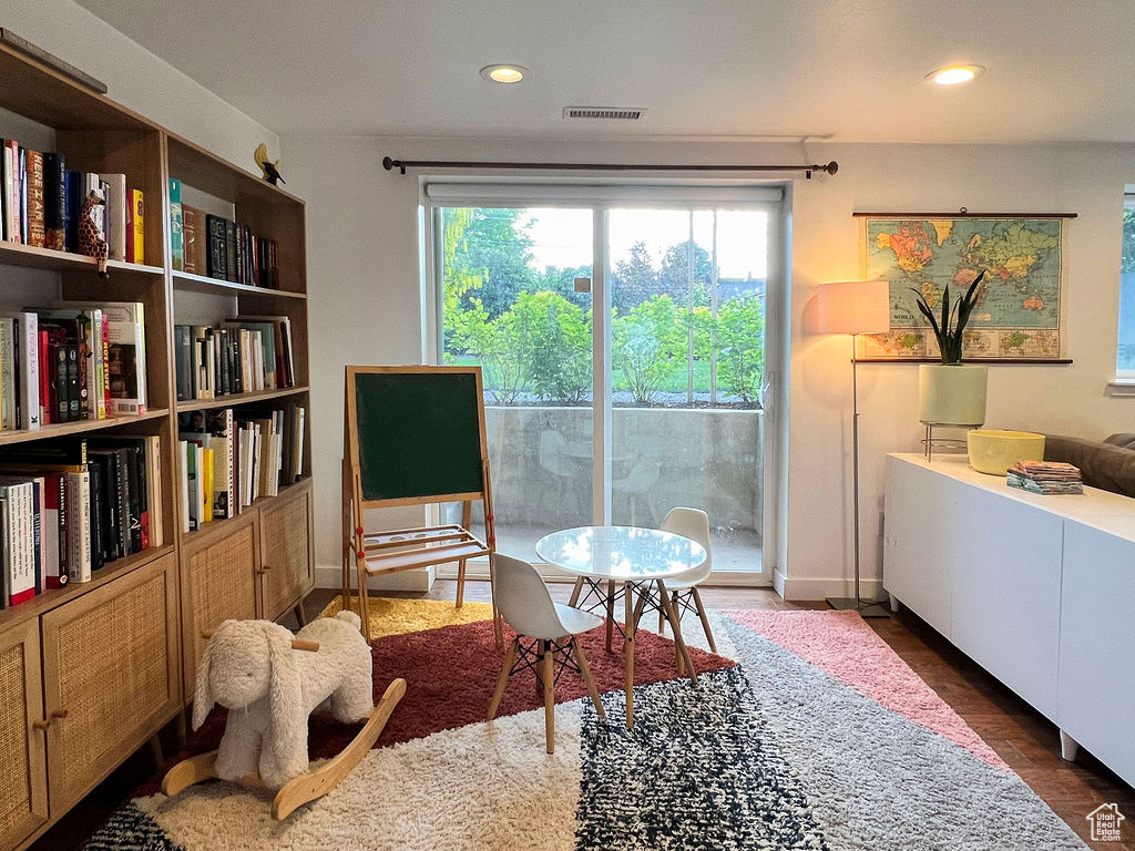 Living area with recessed lighting and wood finished floors