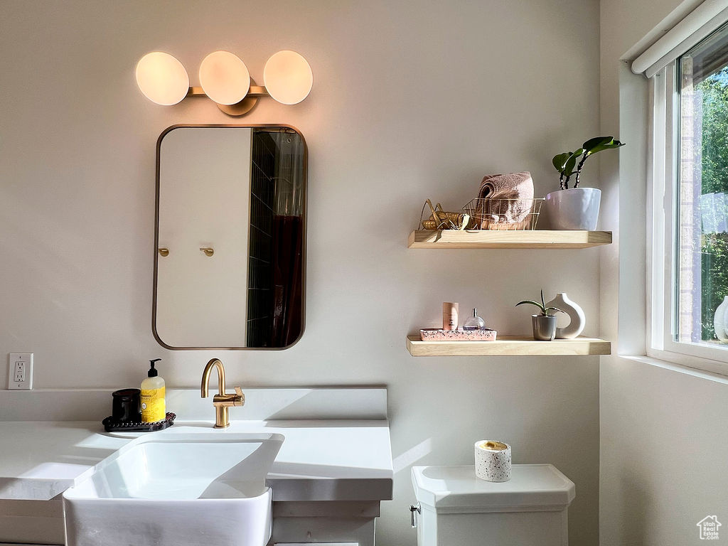 Bathroom with a sink and toilet