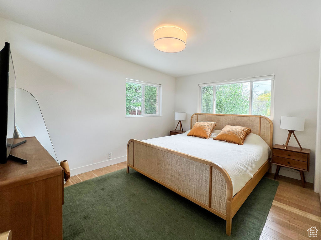 Bedroom featuring light wood-type flooring and baseboards