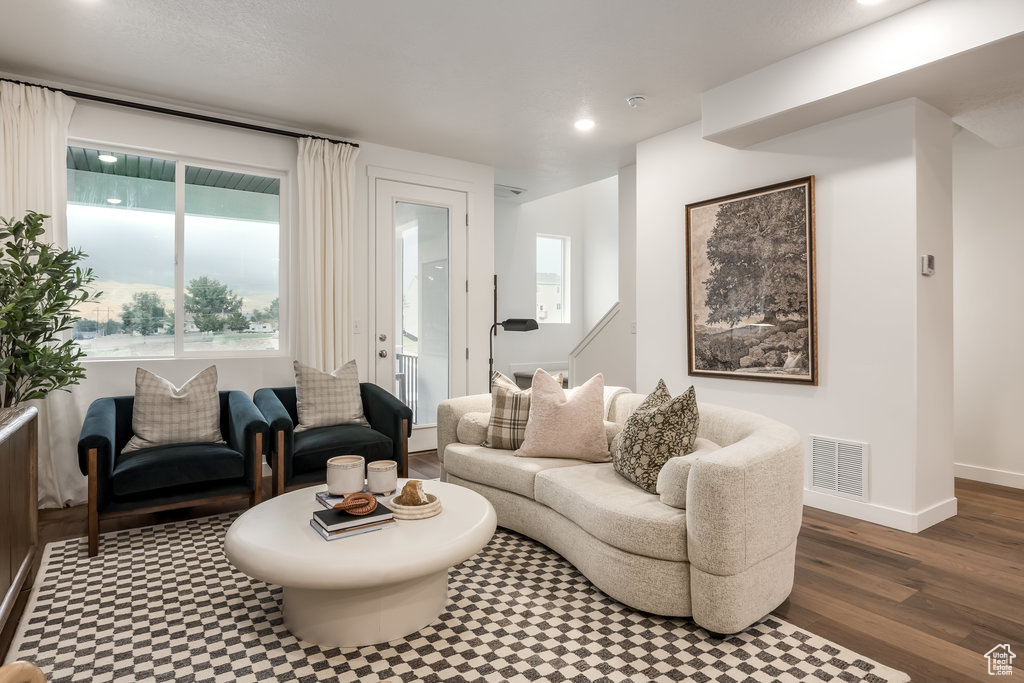 Living area featuring recessed lighting, wood finished floors, and baseboards