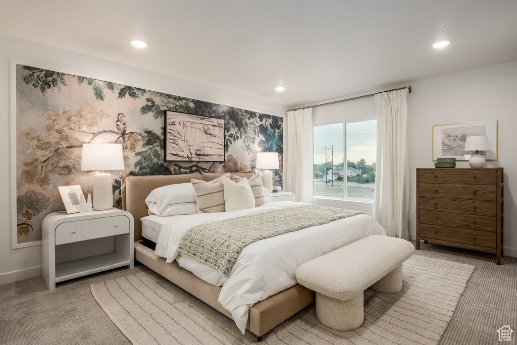 Bedroom with light carpet, recessed lighting, and baseboards