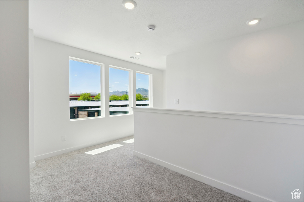 Empty room with baseboards, carpet flooring, and recessed lighting