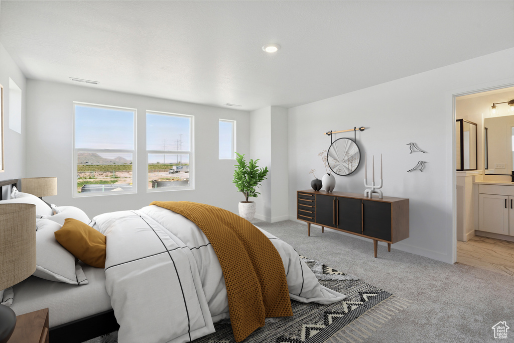 Bedroom with light colored carpet, baseboards, connected bathroom, and recessed lighting