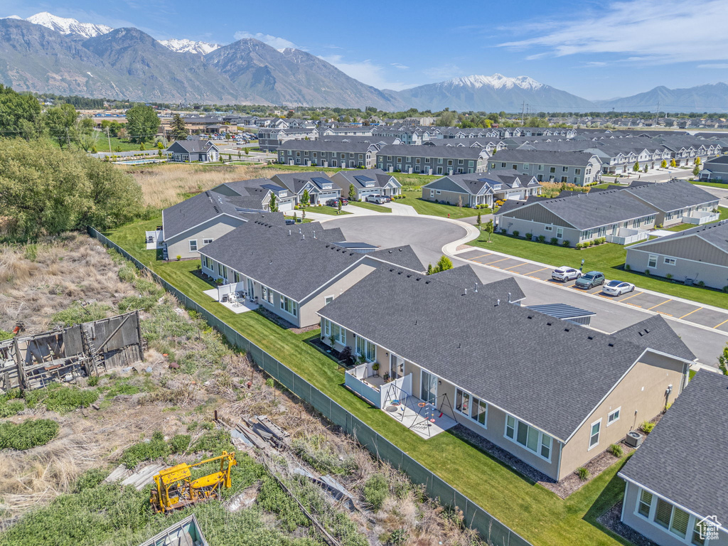 Aerial view of residential area featuring a mountainous background